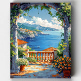 Colorful painting of a Mediterranean scene with houses, flowers, and mountains.