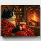 Cat in a red sweater holding a mug by a fireplace