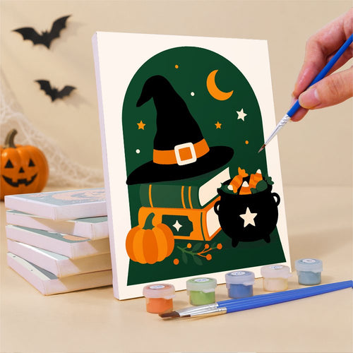 Painting one of the Arched Window Halloween mini canvases with a fine brush