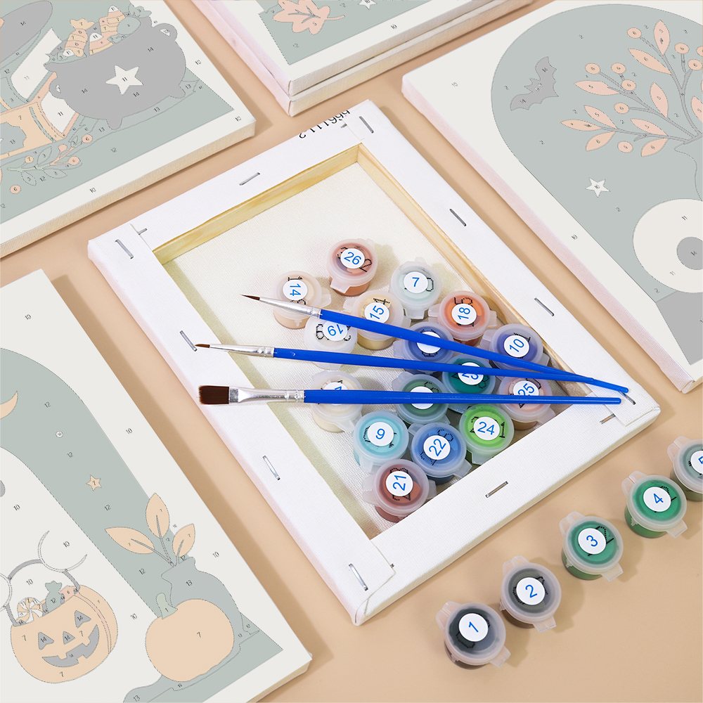 Numbered canvases, paint pots and brushes from the Arched Window Halloween set