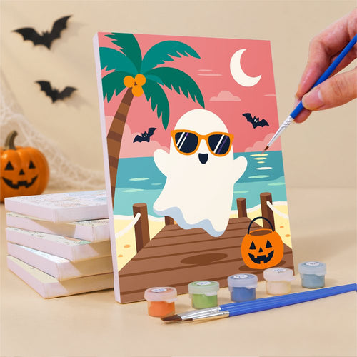 Painting one of the Beach Day Spooks mini canvases with a fine brush
