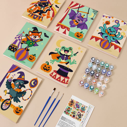 Big Top Spooks kit contents with six numbered canvases, paints, brushes and reference sheet