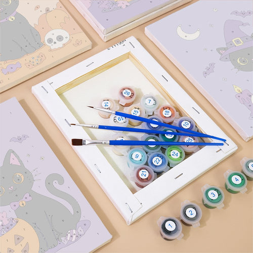 Numbered canvases, paint pots and brushes from the Black Kitten Candy Night set