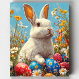 Painting of a white rabbit surrounded by Easter eggs and flowers