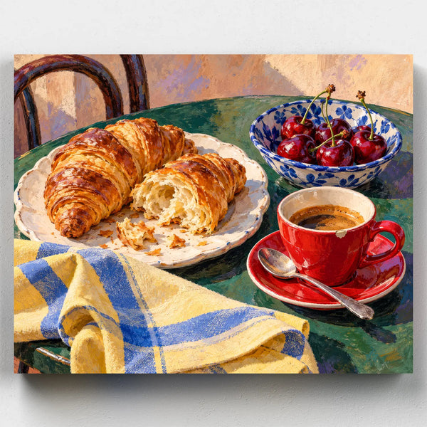 Café Breakfast paint by numbers kit with croissants, a red espresso cup and cherries on a green café table