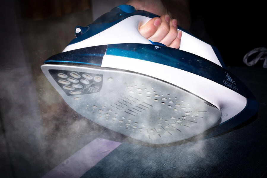 A steaming iron to learn how to flatten a paint by numbers canvas