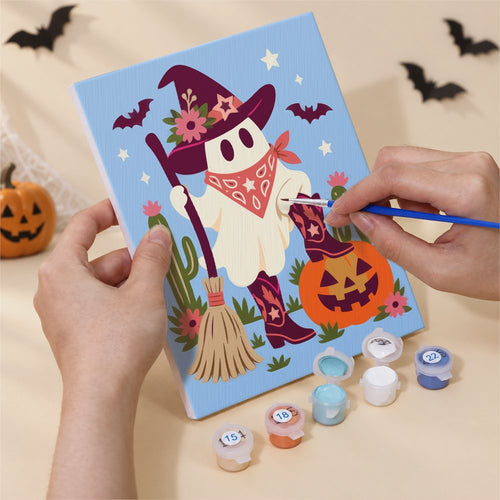 Hands painting a Candy-Colored Cowpokes design by numbers