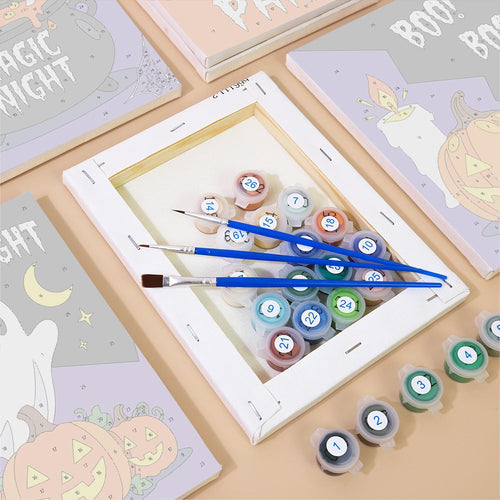 Numbered canvases, paint pots and brushes from the Cauldron & Candle Signs set