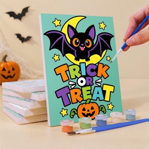 Painting one of the Comic Pop Lettering mini canvases with a fine brush