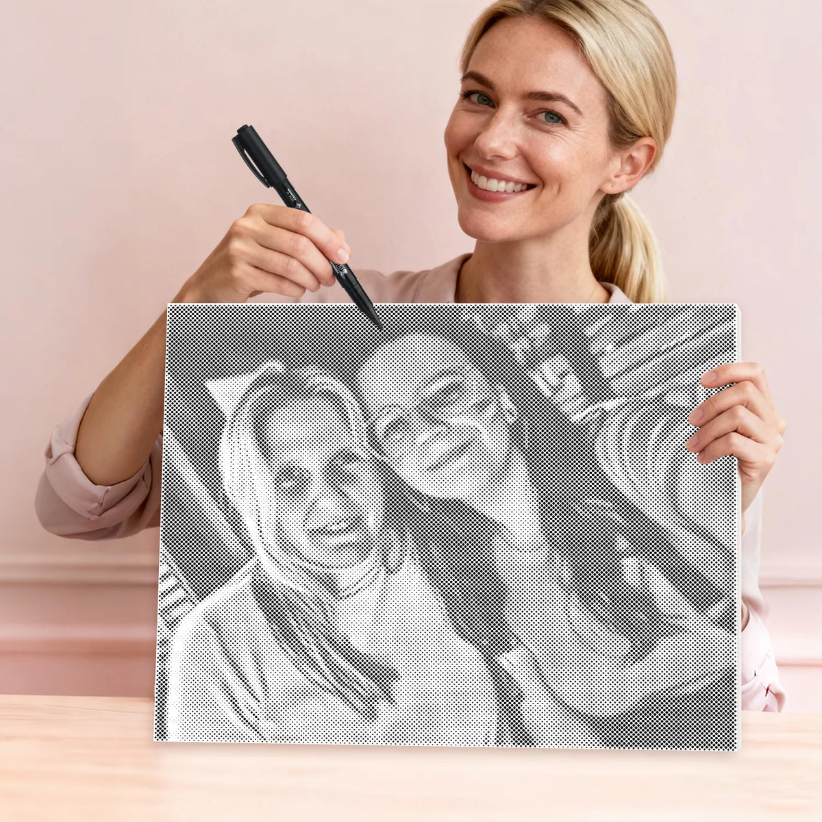 Woman marking a custom dot painting canvas with a permanent marker
