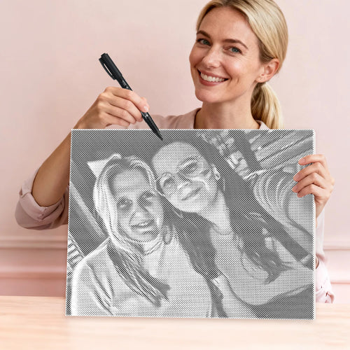 Woman marking a custom dot painting canvas with a permanent marker