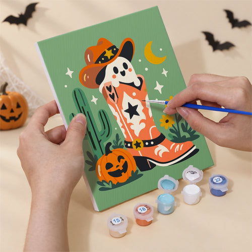 Hands painting a Desert Cowboy Spooks design by numbers