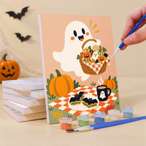 Painting one of the Gingham Blanket Ghouls mini canvases with a fine brush
