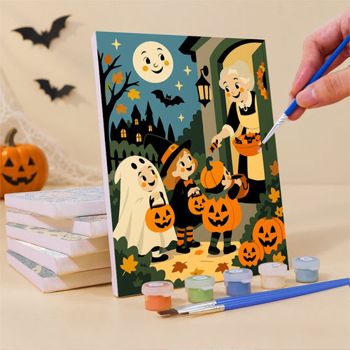 Painting one of the Grinning Moon Village mini canvases with a fine brush