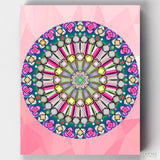 A colorful kaleidoscope mandala paint by number with pink background numbered on canvas - This Harmony Mandala Paint by Numbers is a product form Canvas by Numbers. 