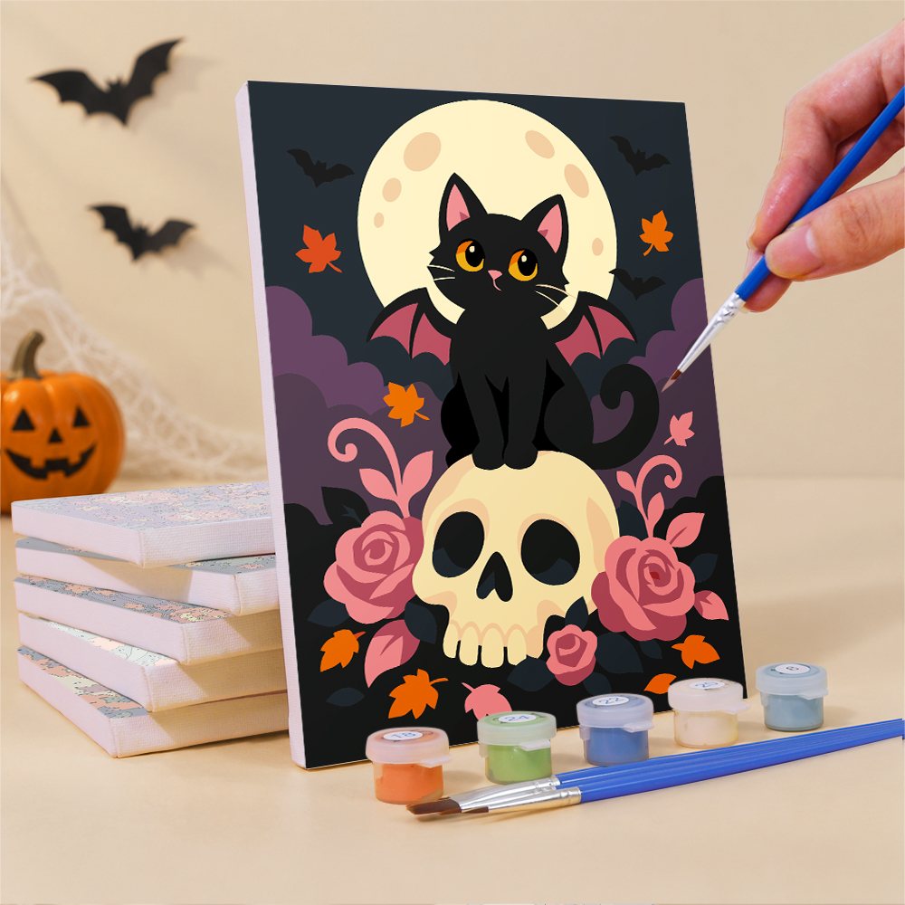 Painting one of the Harvest Night Haunts mini canvases with a fine brush