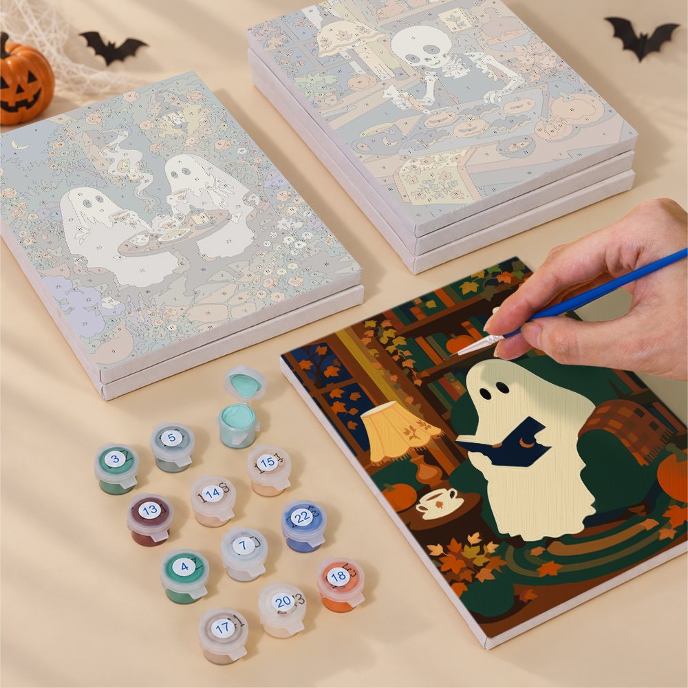 Blank numbered Lamplit Hearth & Hauntings canvases next to acrylic paint pots