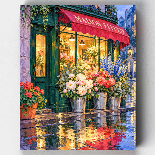 Maison Fleurie paint by numbers kit with a green Paris flower shop and its reflection on wet pavement