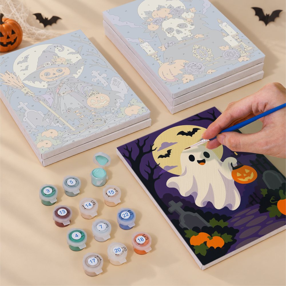 Blank numbered Midnight Graveyard canvases next to acrylic paint pots