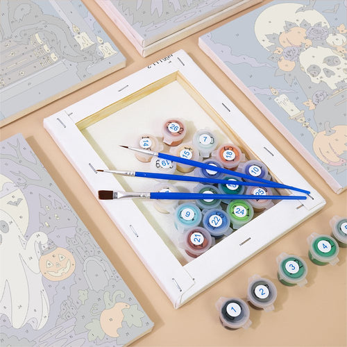 Numbered canvases, paint pots and brushes from the Midnight Graveyard set