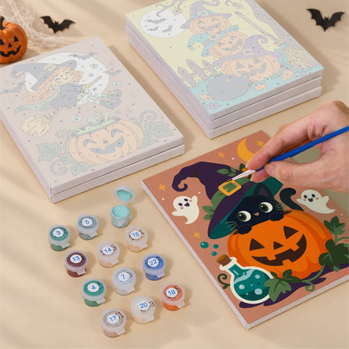 Blank numbered Mischief in the Gourds canvases next to acrylic paint pots