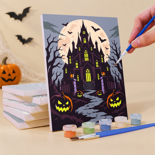 Painting one of the Nightmare Cathedral mini canvases with a fine brush