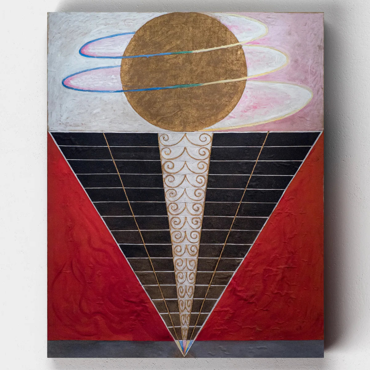 Abstract art piece with geometric shapes and colors on a textured surface