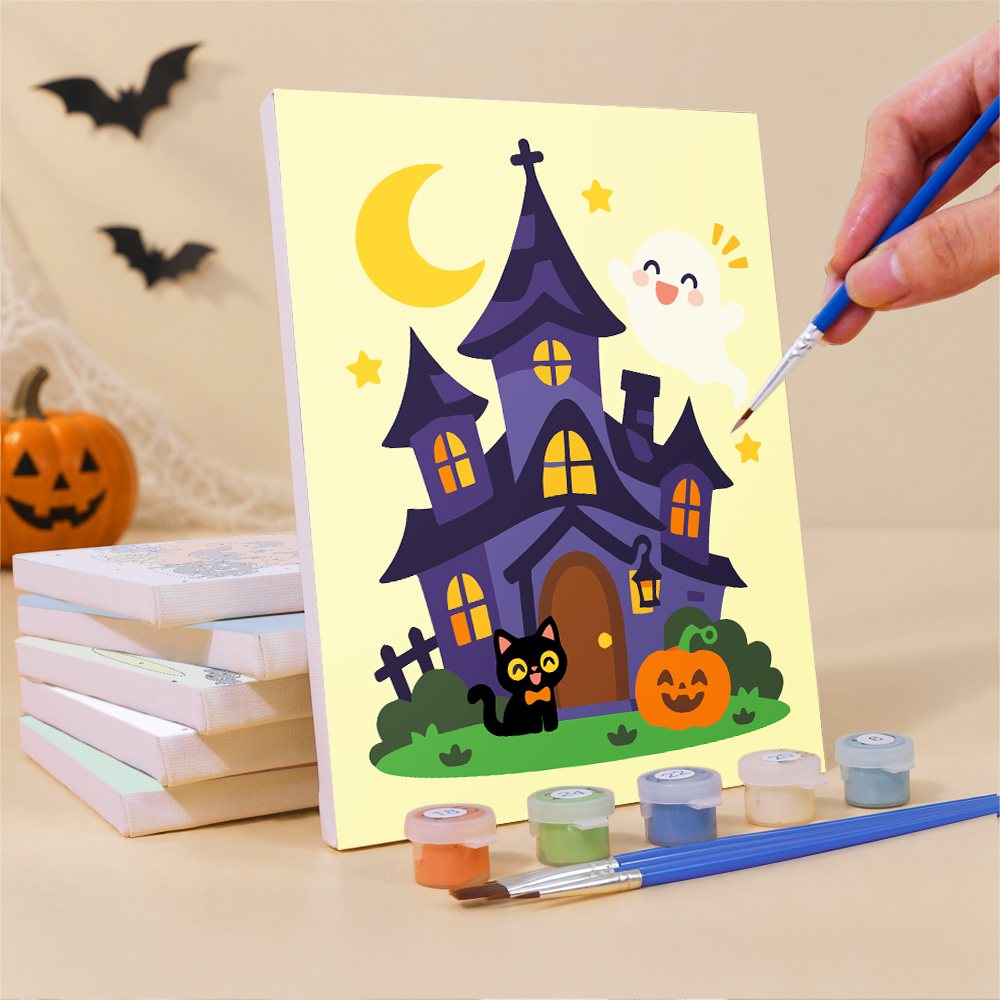 Painting one of the Pocket-Size Costume Kids mini canvases with a fine brush