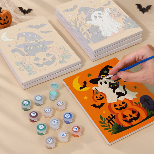 Blank numbered Pointy Hat Spooks canvases next to acrylic paint pots