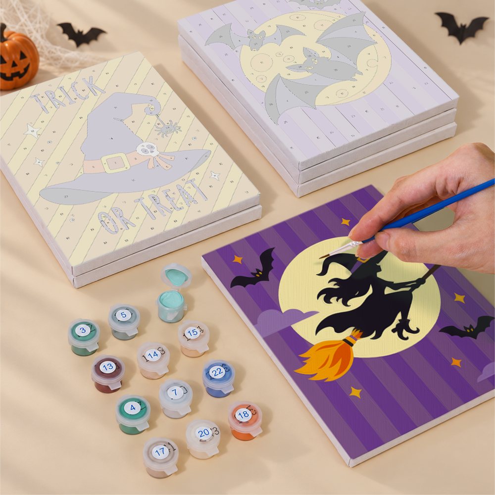 Blank numbered Polka Dot Bat Party canvases next to acrylic paint pots