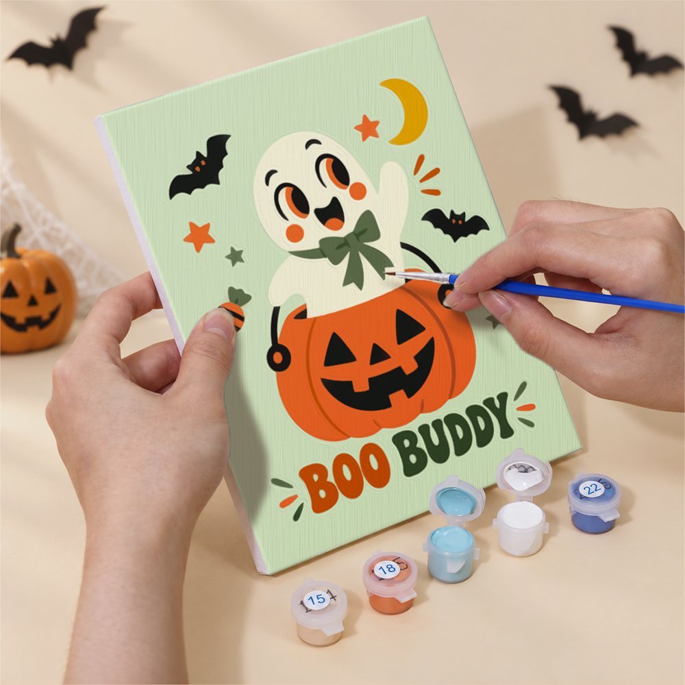 Hands painting a Retro Halloween Mascots design by numbers