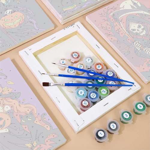 Numbered canvases, paint pots and brushes from the Scythes & Broomsticks set