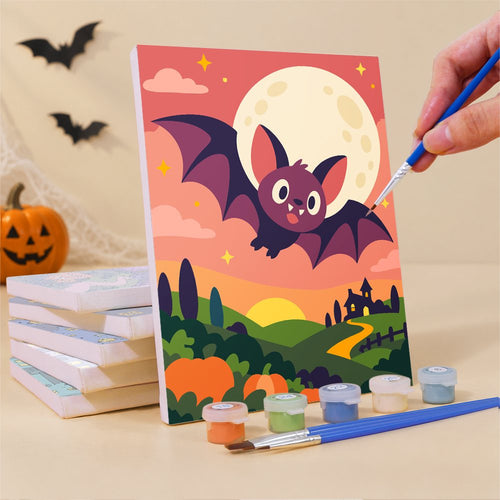 Painting one of the Sherbet Sunset Spooks mini canvases with a fine brush