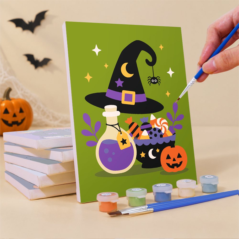 Painting one of the Starlit Orange Moon Night mini canvases with a fine brush