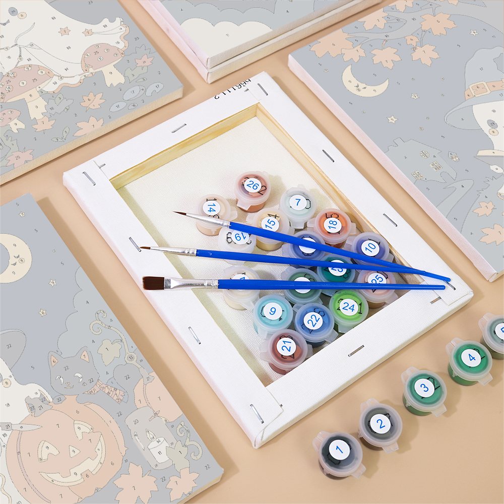 Numbered canvases, paint pots and brushes from the Starry Ghost Wanderers set