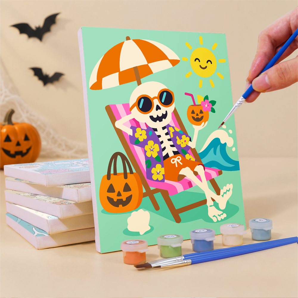 Painting one of the Sunbathing Skeletons mini canvases with a fine brush