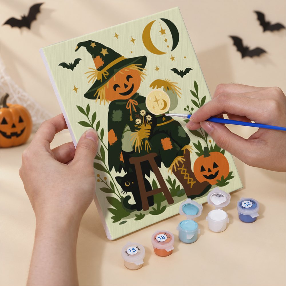 Hands painting a Sunflower Scarecrows design by numbers