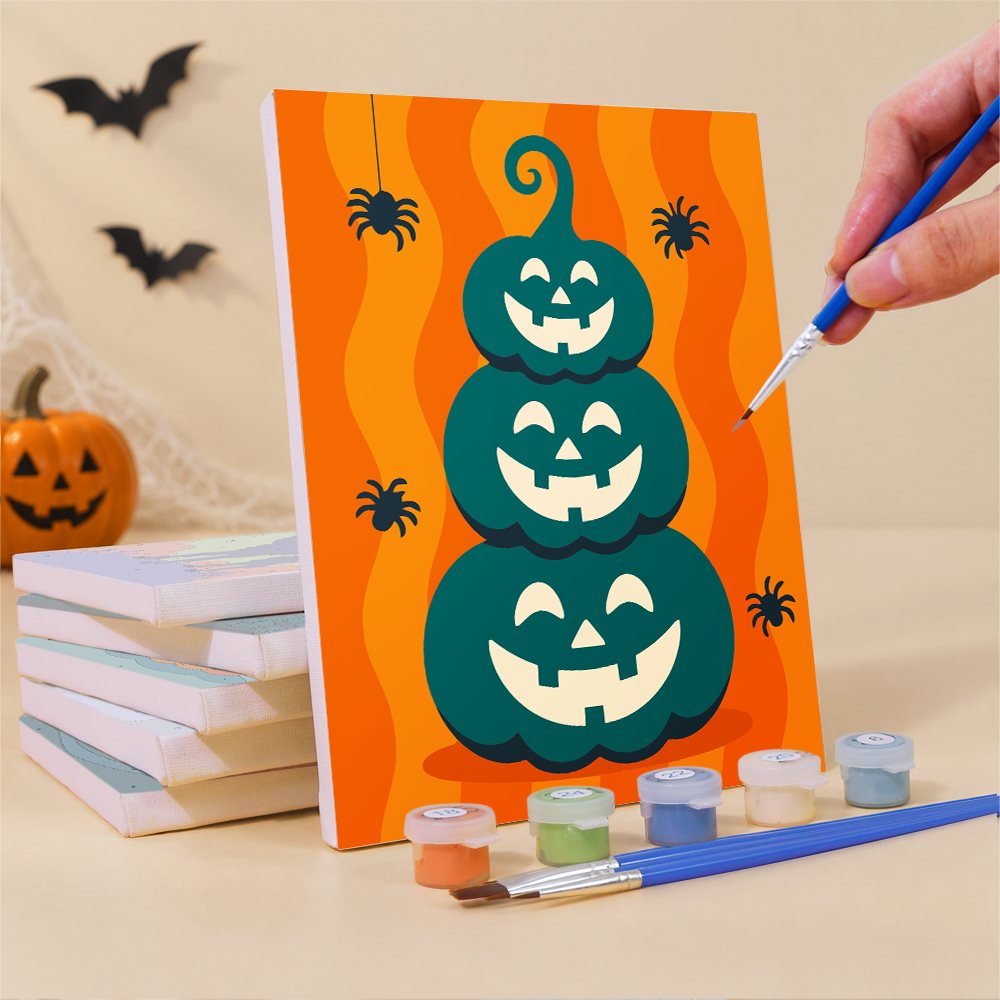 Painting one of the Teal & Tangerine Halloween mini canvases with a fine brush