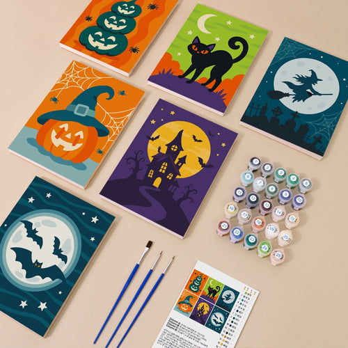 Teal & Tangerine Halloween kit contents with six numbered canvases, paints, brushes and reference sheet