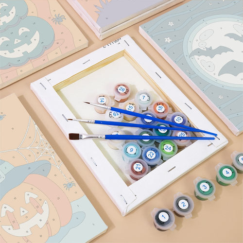 Numbered canvases, paint pots and brushes from the Teal & Tangerine Halloween set