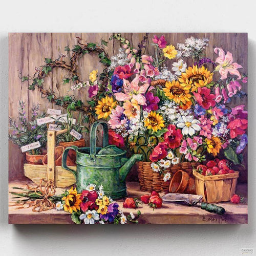The Potting Bench. A paint by numbers kit depicting a wonderful still life full of colorful flowers and gardening tools on a wooden bench. Exclusive to Canvas by Numbers.