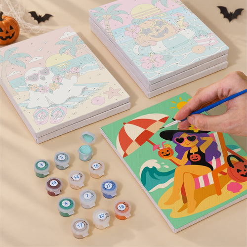 Blank numbered Tropical Monster Getaway canvases next to acrylic paint pots