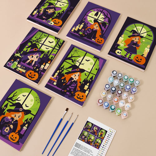 Witches at the Window kit contents with six numbered canvases, paints, brushes and reference sheet