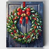 Festive Christmas wreath decorated with holly, red berries, pinecones, and a bright red bow, hanging on a snowy wooden door with falling snowflakes.